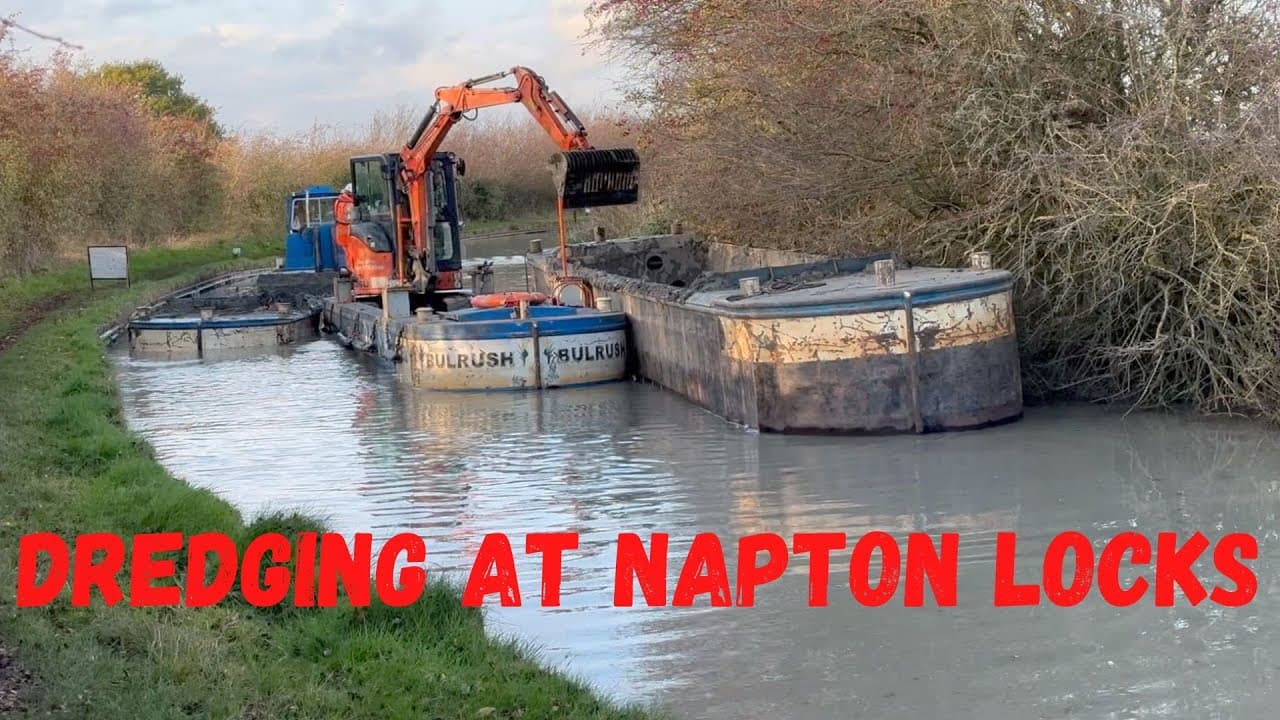 Dredging on the South Oxford Canal around Moored Narrowboat. Napton Locks. CRT winter works.