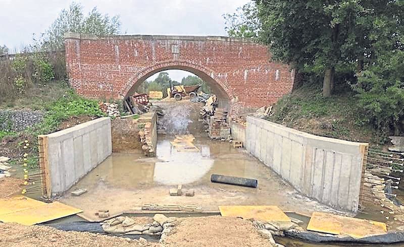 BRIDGE REBUILT with help from group volunteers
